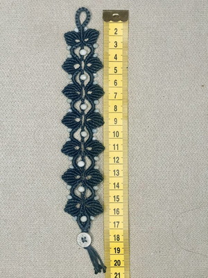 Handmade macrame bracelet with white beads, dark blue