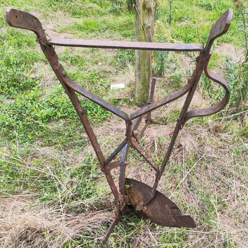 Antique plow used for garden decoration