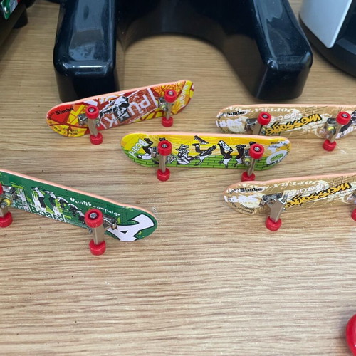 Used toys with figure spinners and skates