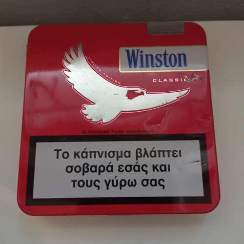 Camel and Winston collectible metal cigarette packs