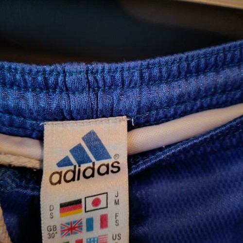 Adidas Originals blue athletic swim shorts with white drawstring