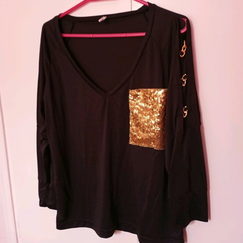 Black elastic blouse with sequin pocket and cutout, like new
