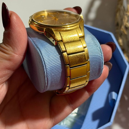 Vogue watch used, gold color with scratches
