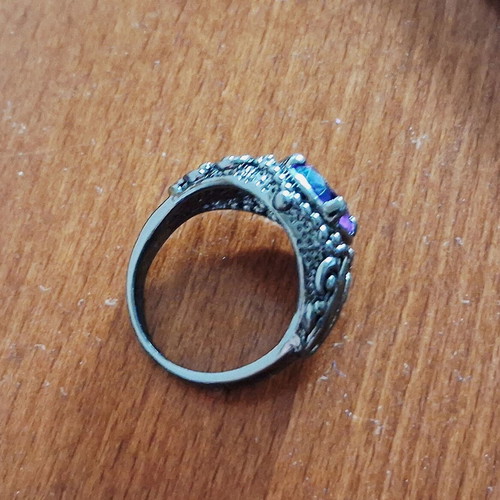 Ring with blue sapphire new, black rhodium plating
