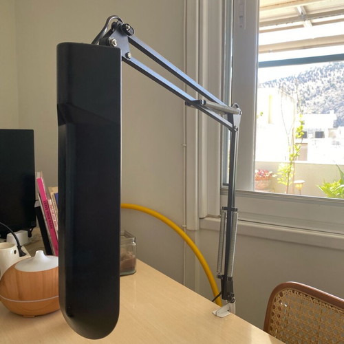Black screw-on desk lamp used, industrial design