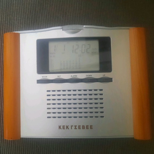Retro digital tabletop clock with day, month, and year display