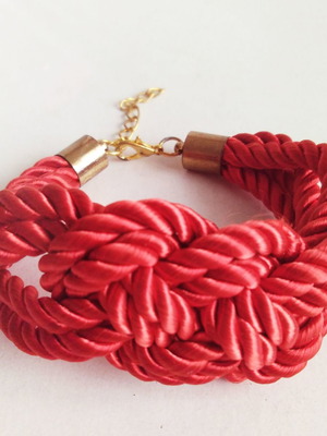 Bracelet with red cords used