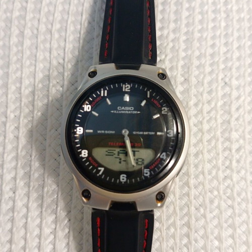 Casio Illuminator WR50M wristwatch like new with red stitched strap