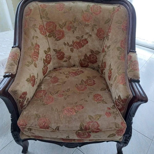 Set of classic armchairs used with carved wooden frame and floral fabric