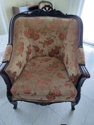 Classic armchairs set used with carved wooden frame and floral upholstery