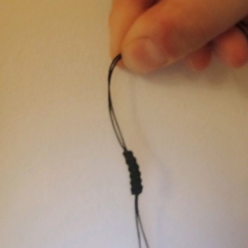 Adjustable necklace used with gold, silver, and dark gray