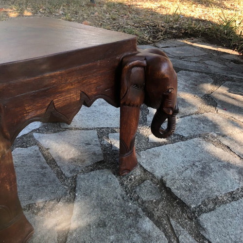 Handcrafted carved wood table with elephants and matching stool, Asian style