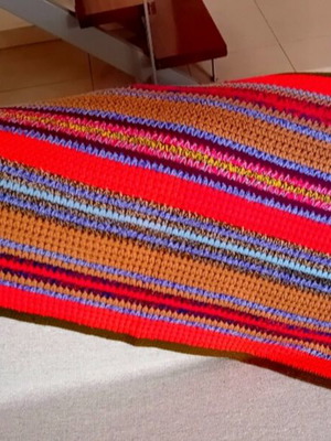 Handmade knitted vintage throw rug with colorful stripes