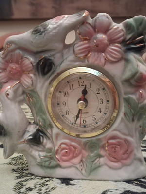 Vintage porcelain table clock with embossed pink flowers and gold details used