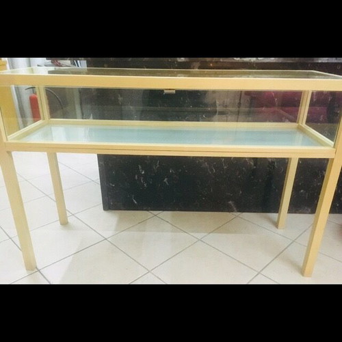 Console used with wooden frame and glass surfaces