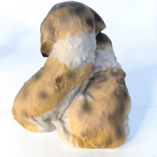 Decorative resin figurine of two puppies used