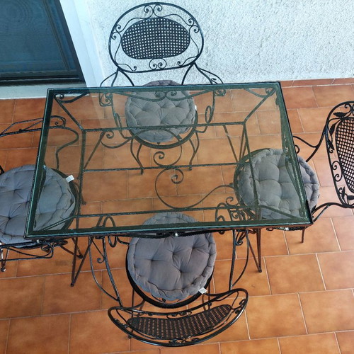 Black wrought iron garden set used with table and 4 chairs