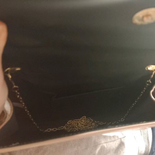 Pink clutch used with chain and slight wear