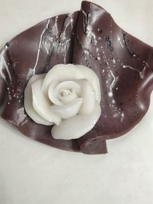 Rose candle like new with brown wax base