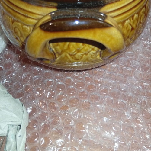 Traditional ceramic clay pot with lid and side handles