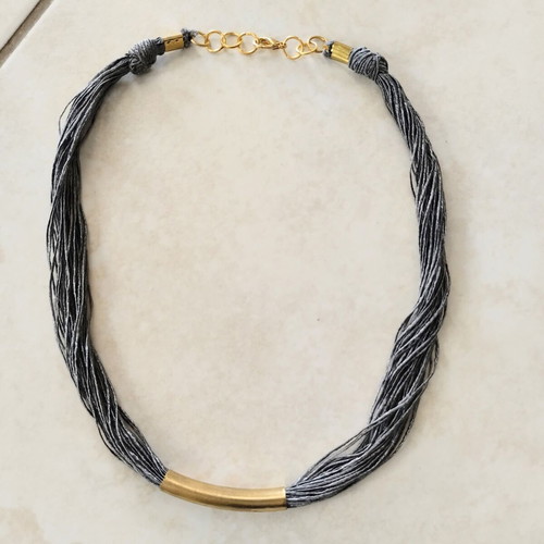 Minimal handmade necklace used, silk thread with metal element