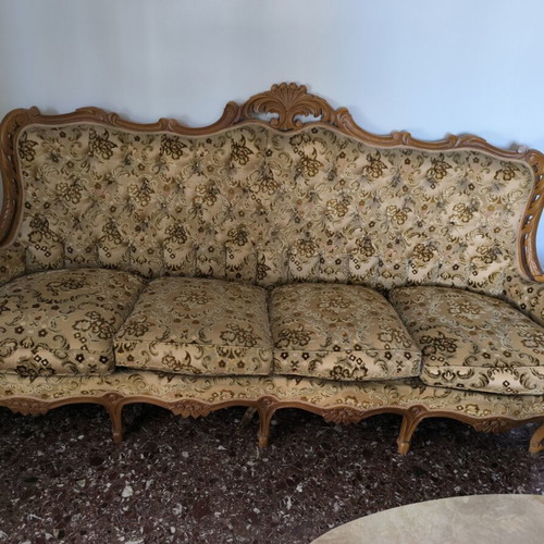 Sofa like new, four-seater with carved headrest