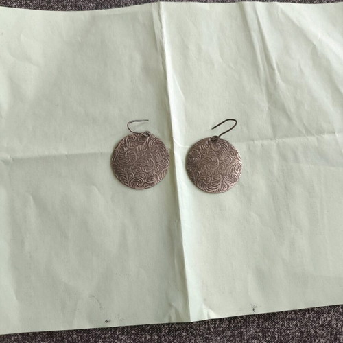 Earrings used, silver color