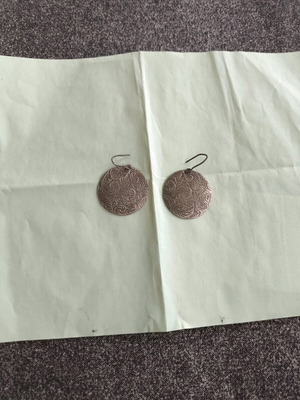 Earrings used, silver color