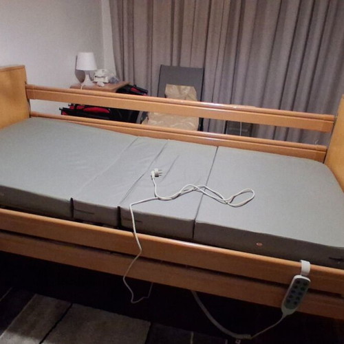 Electric hospital bed like new with mattress, wheels, and patient lifter