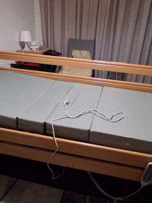 Electric hospital bed like new with mattress, wheels, and patient lifter