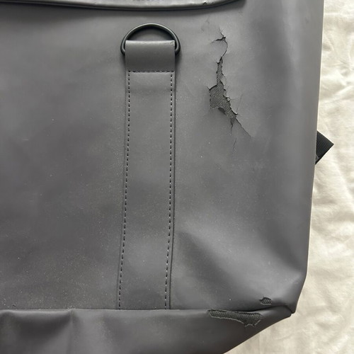 Rains backpack men's used with front wear, gray