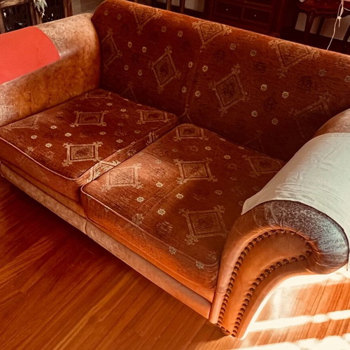 Classic two-seater sofa with fabric and leather upholstery