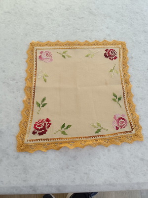 Linen decorative square with cross-stitch and knitted lace, used