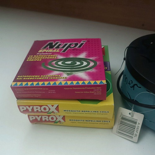 Insect repellent container like new, pack with coils