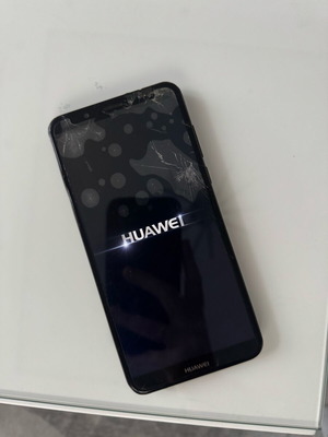 Huawei cell phone used with broken screen, black