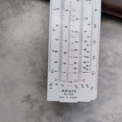 Vintage logarithmic slide rule in case like new