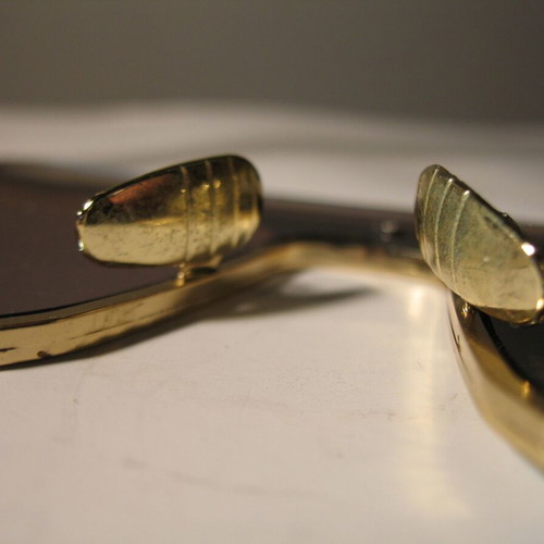Stylish women's sunglasses with blue mirrored lenses, gold frame