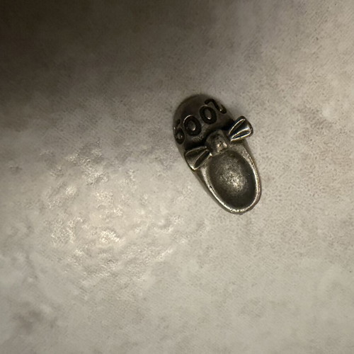 Silver children's small shoe charm 2009, used