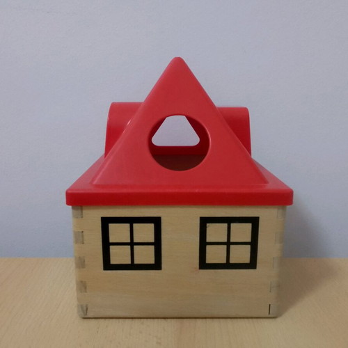 Wooden toys used with house, boat, and shapes