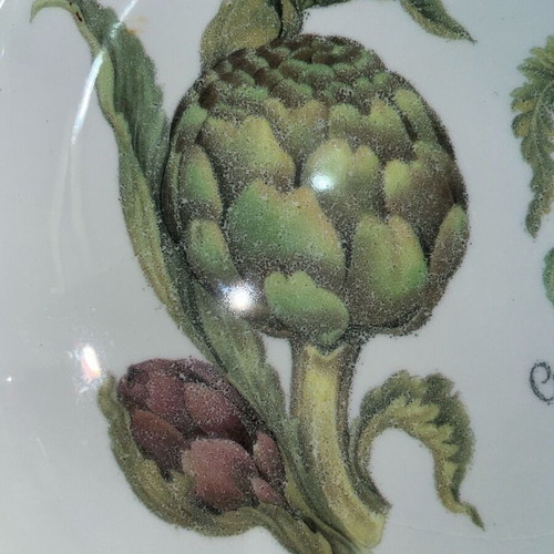 Ceramic serving dish used with artichoke design