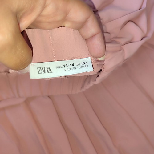 Zara girls' set with pink pleated culottes and white puff sleeve bodysuit