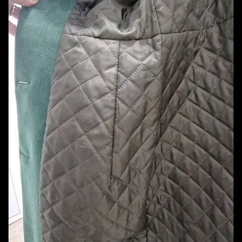 Green coat with embossed pattern like new, size 40