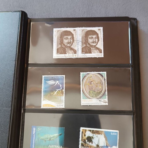 Stamp album with 120 stamps like new, Greece Australia Cyprus Germany America Canada