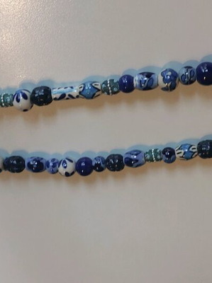 Handmade necklace with ceramic beads in blue shades like new