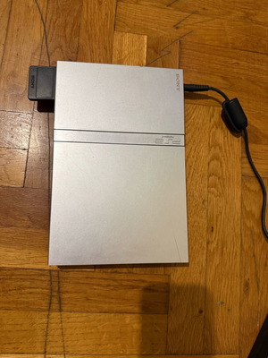PlayStation 2 Slim console used with cables and memory card