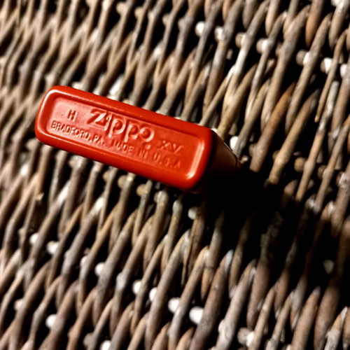 Zippo lighter used, large bright red