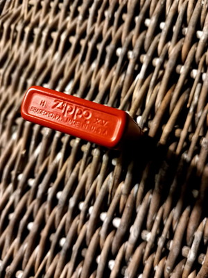 Zippo lighter used, large bright red
