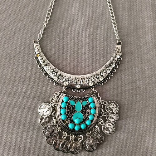 Steel necklace like new, missing one turquoise stone