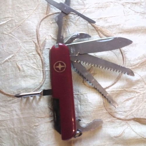 Multitool pocket knife like new with saws, screwdriver, scissors, and more