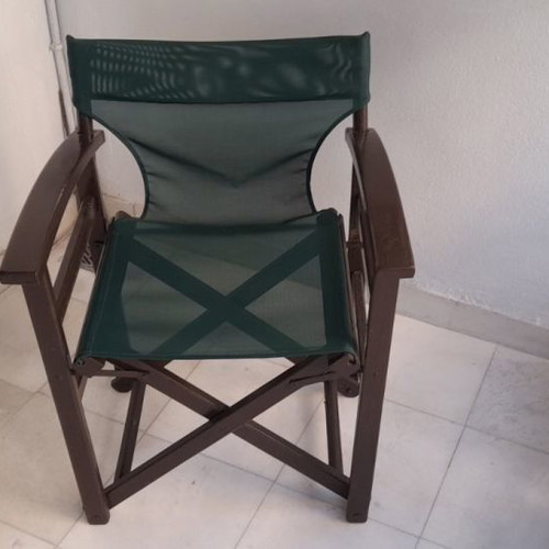 Outdoor lounge furniture used with 4 director chairs and metal table